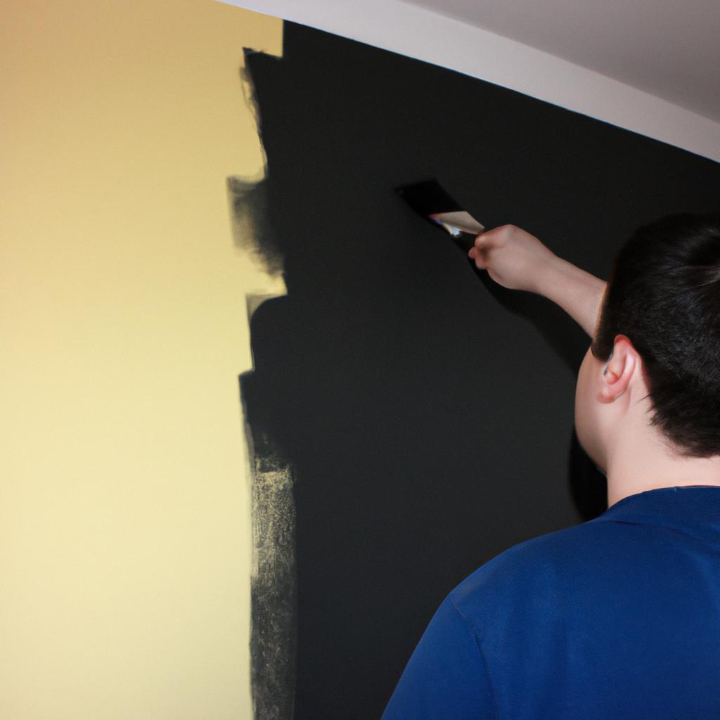 Person painting an accent wall