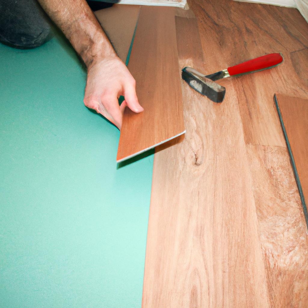 Person installing laminate flooring at home