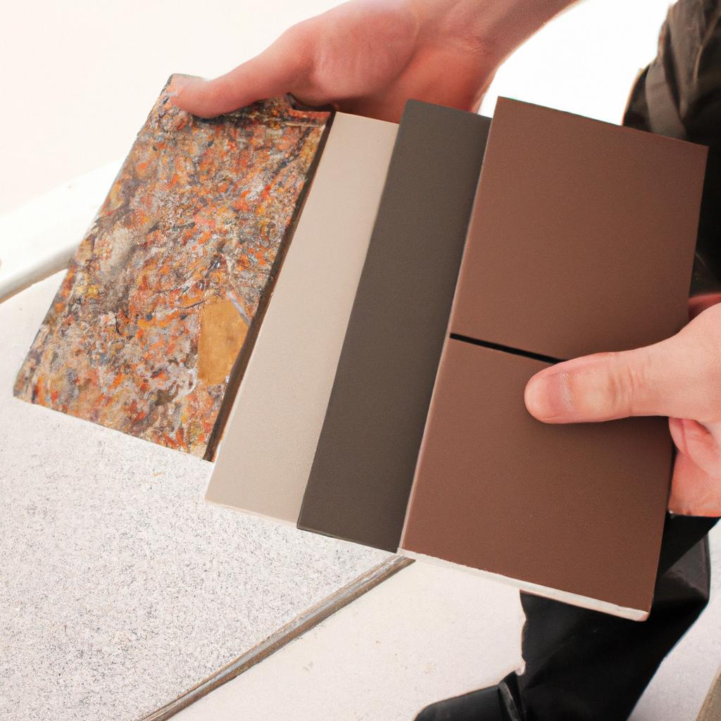 Person holding tile flooring samples