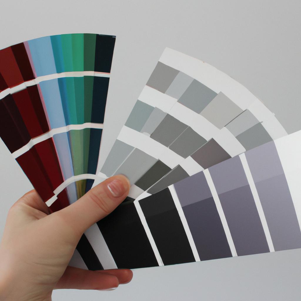 Person holding paint swatches